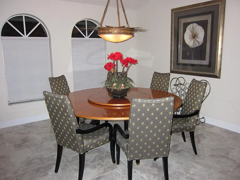 STAGED w/90" round table - dining for 8 + buffet located behind on right side (cannot see in this photo)
