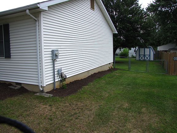 Side of house, gate to back