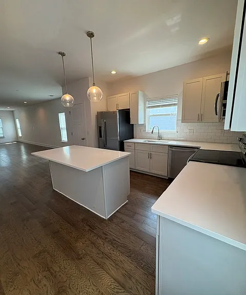 Lots of counter space and the island can accomodate three stools
