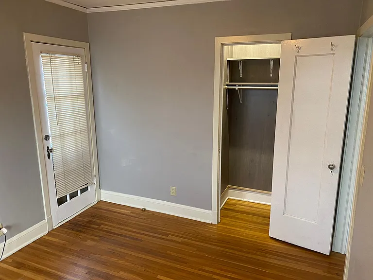 Bedroom that has the private deck. With AC unit.