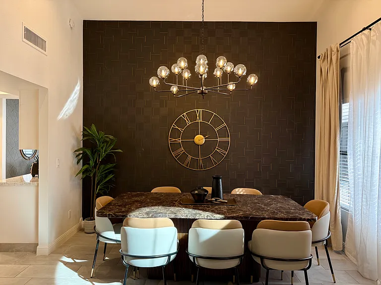 Formal Dining overlooks pool, opens to Family Room and kitchen