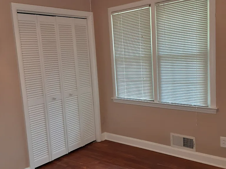 Very smallest bedroom with a shade of tan from Sherwin Williams.