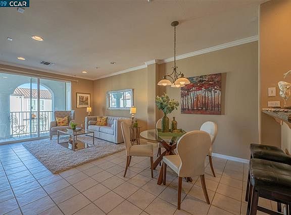 Spacious Living/Dining with Fireplace opens to the balcony