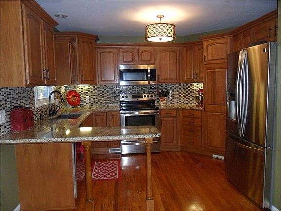 Updated Kitchen w/ Granite Countertops and Stainless Steel Appliances.