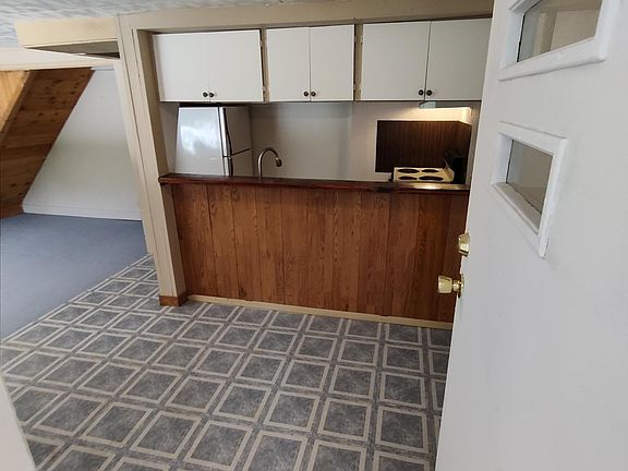 Front door leading into the living room and kitchen.