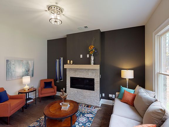 Stunning Details and fireplace to gather round! Photo is a representation of home.