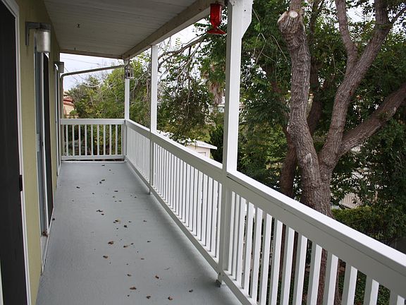 Private balcony extends across both bedrooms and the living room.