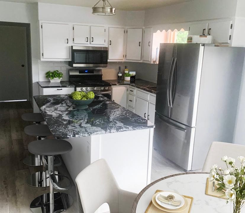 All new appliances and granite. Some items pictured are CGI.