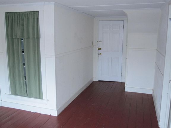 Floor in photo is now gray. Built-in shelving.