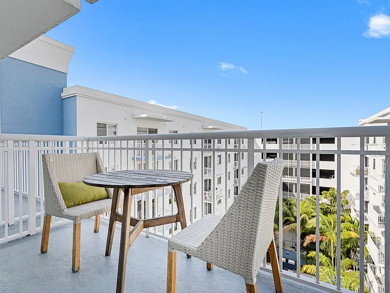 Boca Raton apartment with a view of the Boca City Walk Apartment pool.