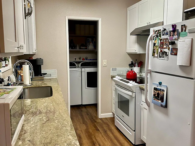 Kitchen with Laundry in Background.