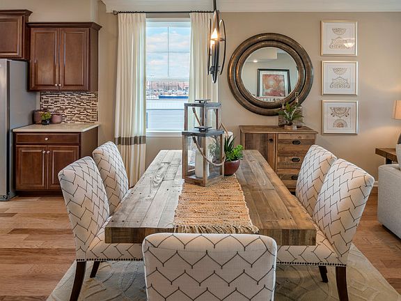 Open layout between the dining area, gathering area and chef inspired kitchen.
