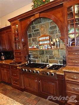 Gourmet Chefs will LOVE this kitchen! Undoubtably one of the prettiest kitchens I have seen! Plus, Very efficient and cutting edge!  Jenn-air Gas Cooktop with grill and downdraft.  All stainless appliances!