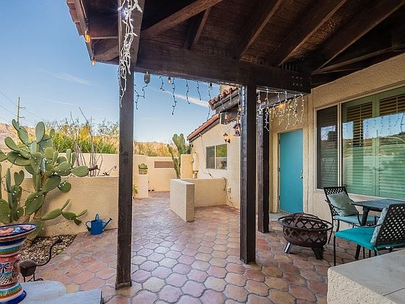 Front patio with mountain views and afternoon shade from the porch and trees to the (left) West of wall.