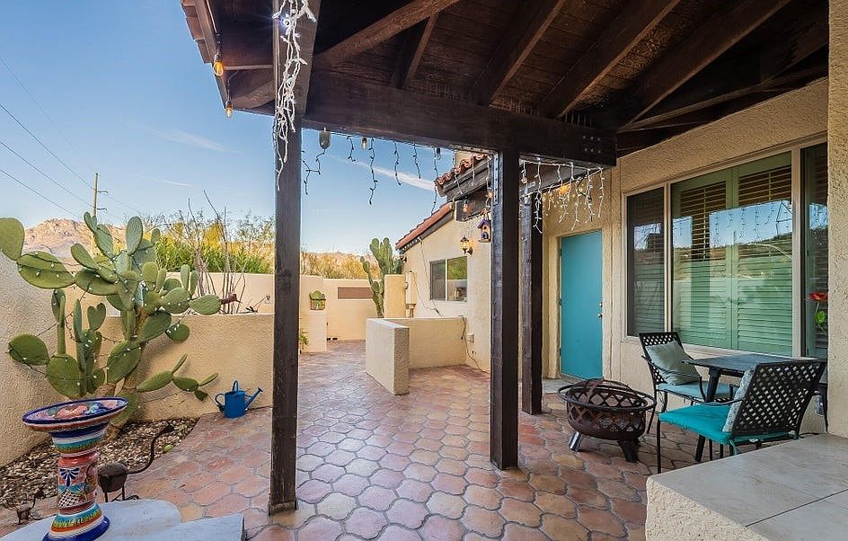 Front patio with mountain views and afternoon shade from the porch and trees to the (left) West of wall.
