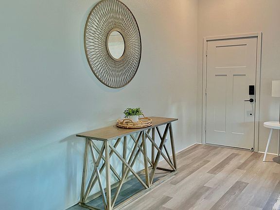 Front Entrance vaulted ceilings; Living Room.