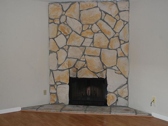 Fireplace w/wall decoration in living room
