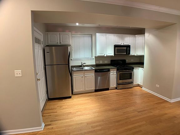 Hardwood floors, granite countertops, stainless steel appliance package with dishwasher and microwave