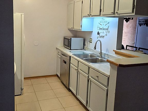 Upgraded cabinets and new countertops. Premium dishwasher, microwave, water-dispenser on refrigerator, ceramic top stove, lots of cabinet space. Breakfast nook.