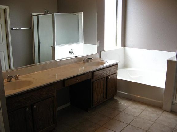 Master Bath is 15 x 8 and features a double sink vanity, separate garden tub.