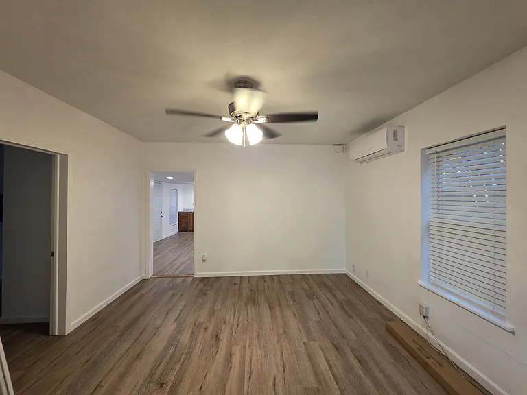 Tv room with 2 ton split unit airconditioning with heat and ceiling fan