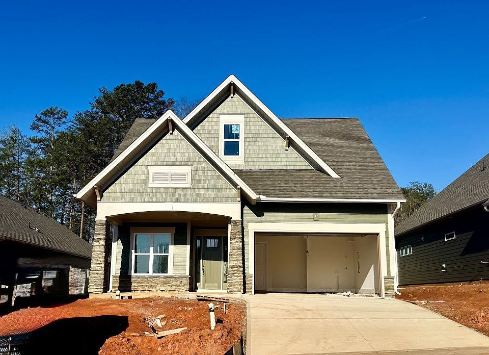 2 story home with a first floor main suite