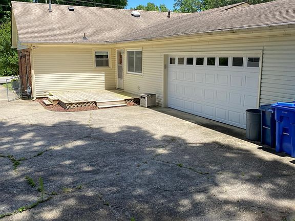 Garage, deck and patio area.