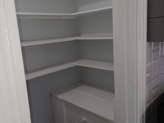 Built-in pantry shelves for extra food and household storage