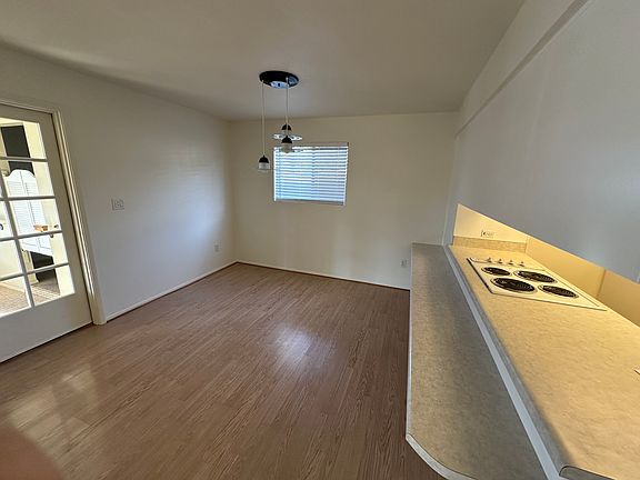 Dining room with breakfast bar and kitchen pass-through.
