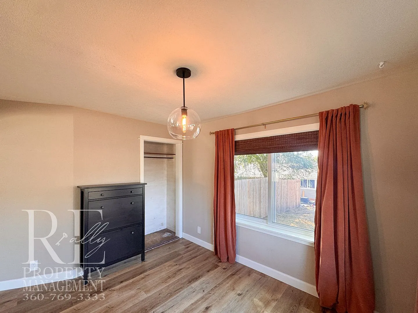 Updated 3-Bedroom Home with Fireplace, Covered Deck & Large Garage — Photo 4