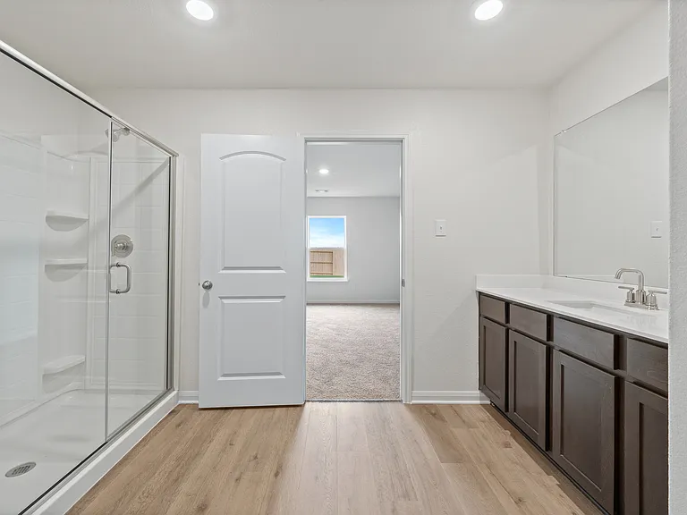 The master bathroom of the Sabine has a large, glass walk-in shower.
