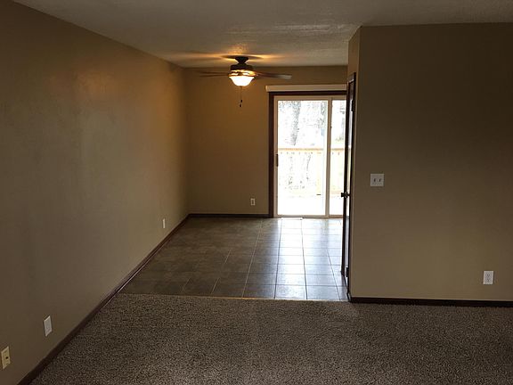 tile floor in dining room leads out to deck and private back