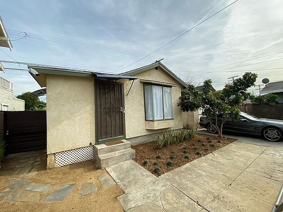 Front entrance with side gate to outdoor laundry and one driveway parking.