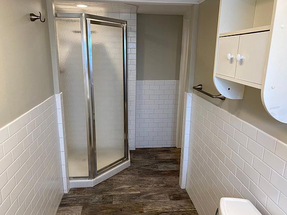 large bathroom with stand up shower