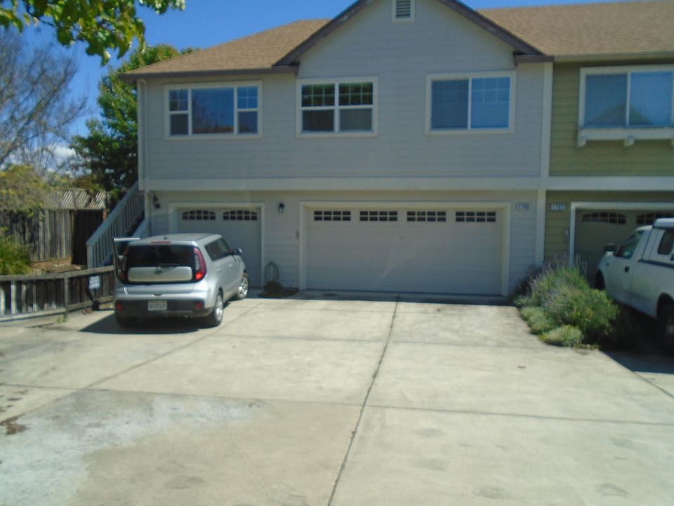 1788 Waltzer, car parked in from of unit's garage.