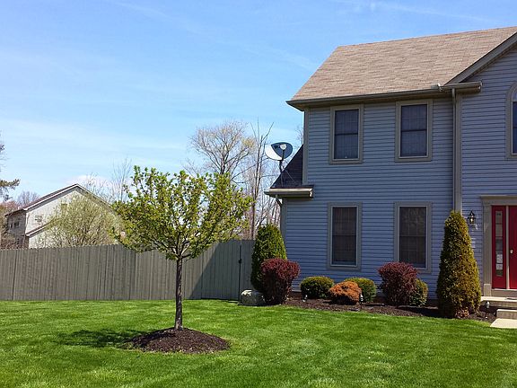 Front showing fence on left.