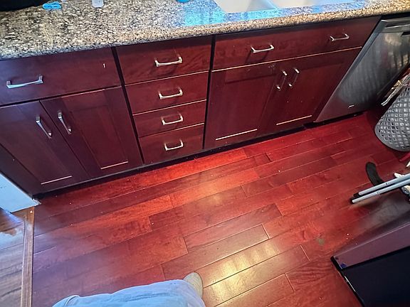 Beautiful, mahogany cabinets, with a granite countertop, and that beautiful floor; all for your pleasure and enjoyment!