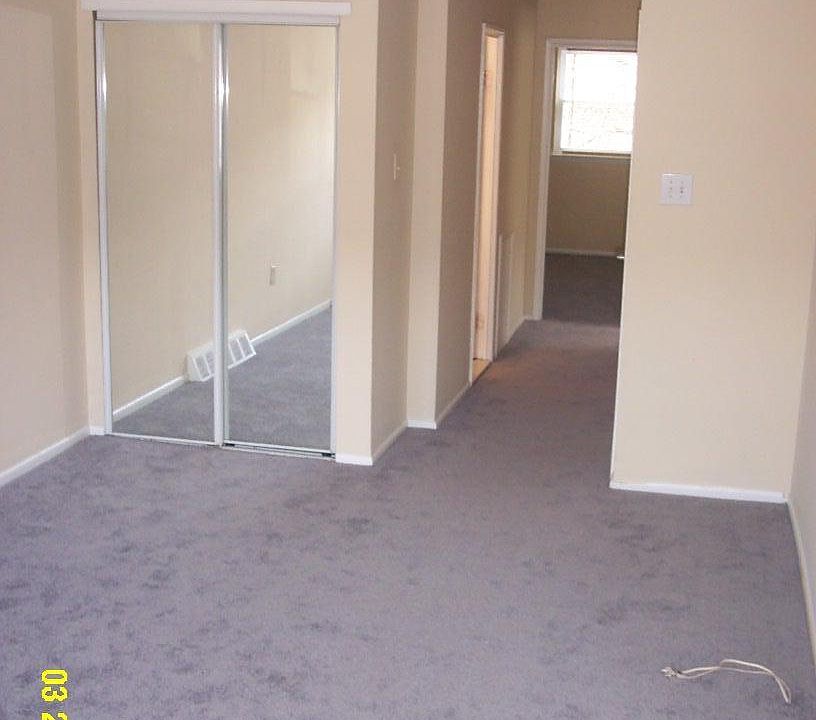 Spacious living room is cable ready with new carpeting.