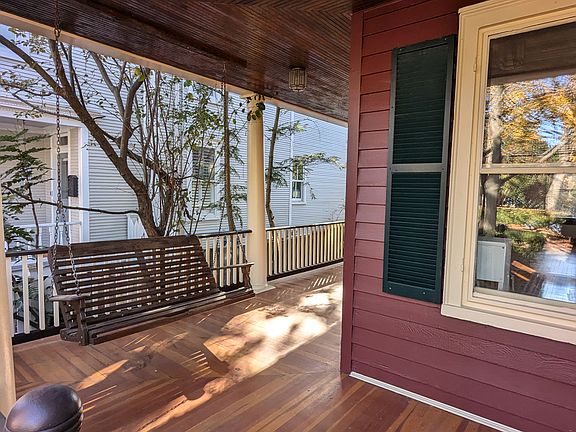 Wrap around front porch with swing