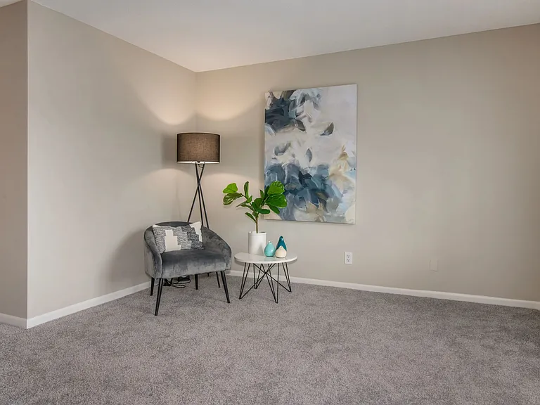 Relax in spacious living rooms with plush flooring and a multi-speed ceiling fan.