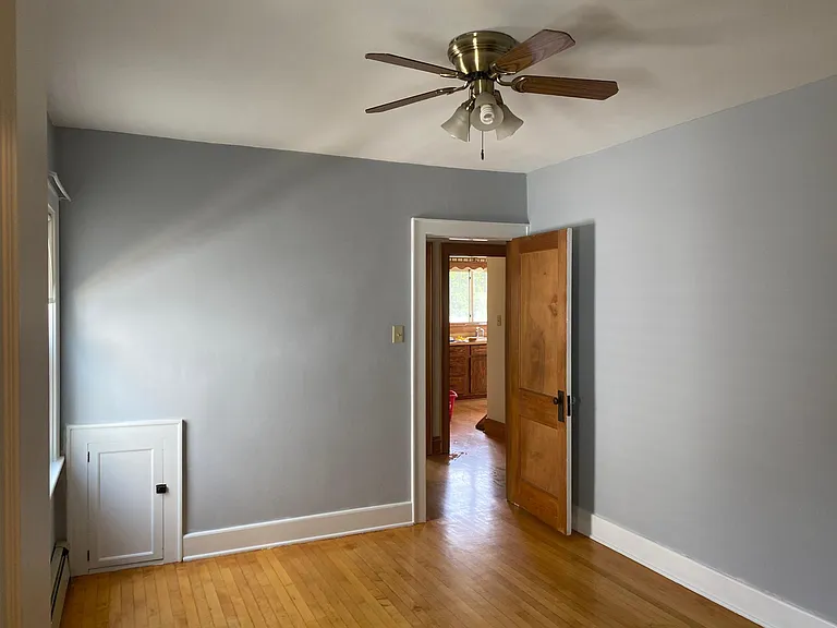 Bedroom 1 looking out toward foyer and kitchen