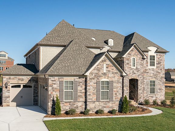 Stonegate Exterior 8 features stone, shakes and covered front porch