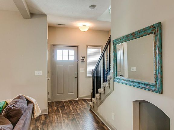 Note the dog house under the stairs