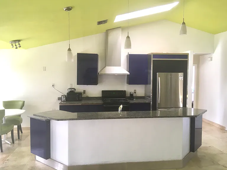 Kitchen island. Breakfast nook on left.