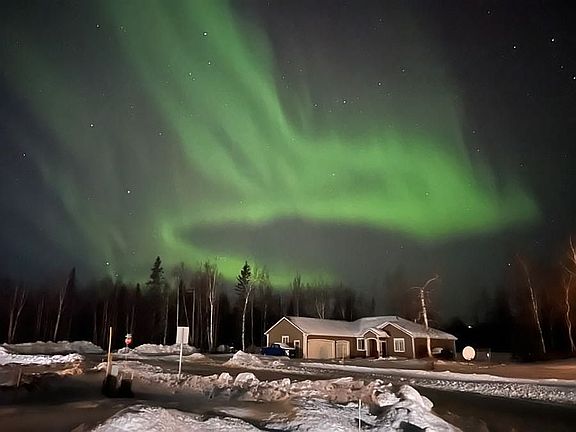 Aurora over house