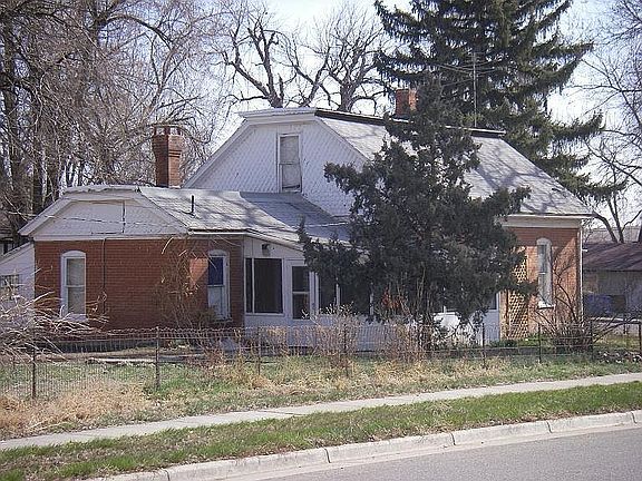 Back of house and porch, with lean to shed