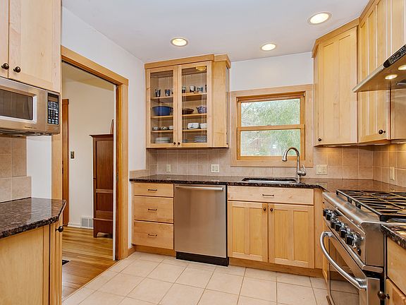 Kitchen features granite counters and stainless appliances