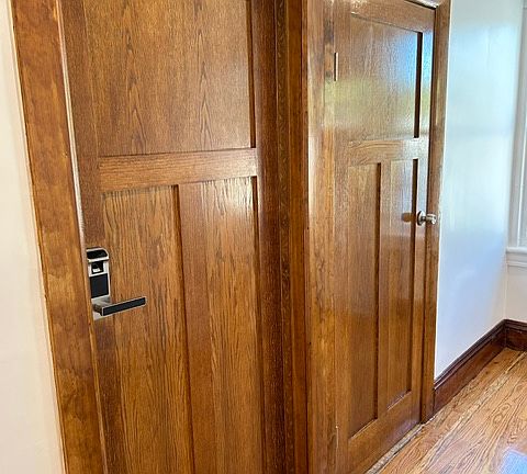 APT DOOR: Gorgeous wood, light filled hallway.
