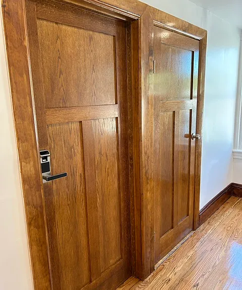 APT DOOR: Gorgeous wood, light filled hallway.