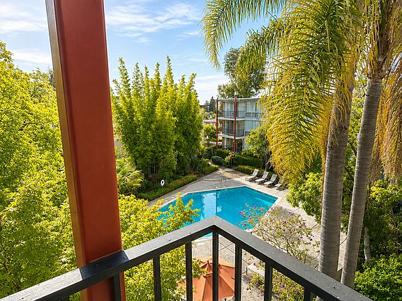 Unit #317 balcony view to pool and landscaped gardens